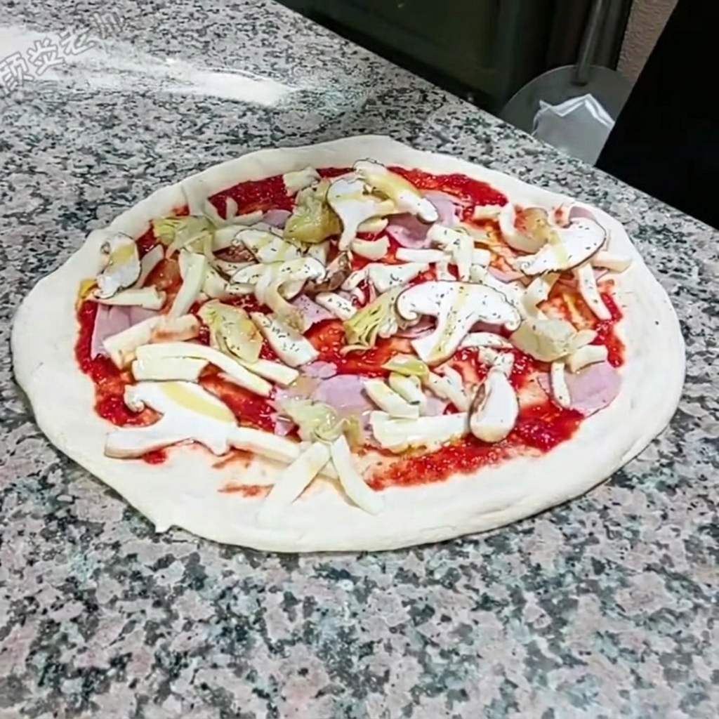 De lorigan séché saupoudré à la main sur la pizza assemblée.