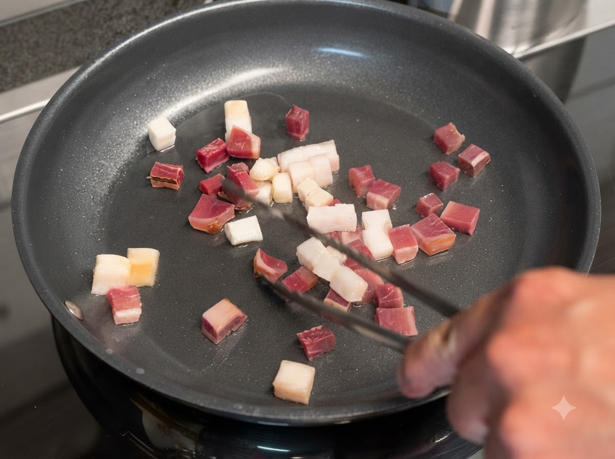 Des cubes de bacon et de viande séchée grésillant dans une poêle et retournés à laide de pinces en métal.