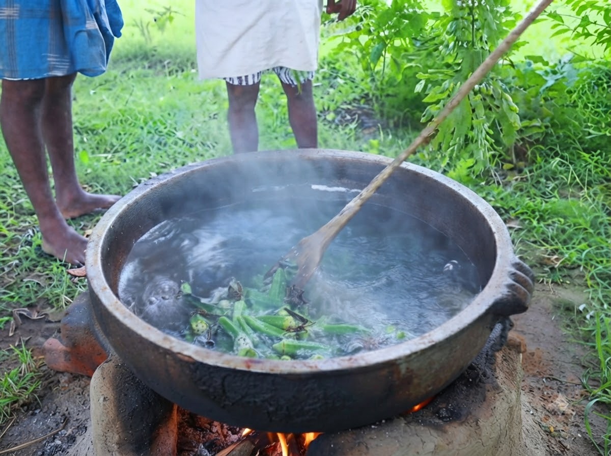 Des feuilles de curry vert frais détachées directement dune branche dans une casserole frémissante dhuile assaisonnée à lextérieur.