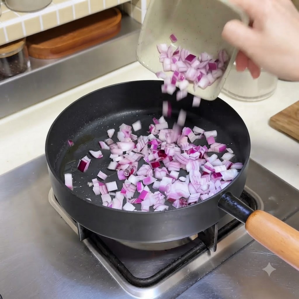 Des dés doignons rouges versés dun petit plat dans une poêle chaude.